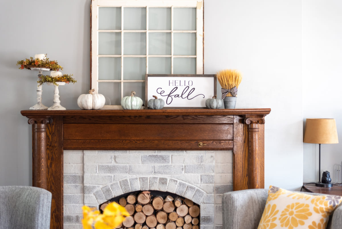A fireplace and fall home decor, we buy houses cash Minneapolis concept
