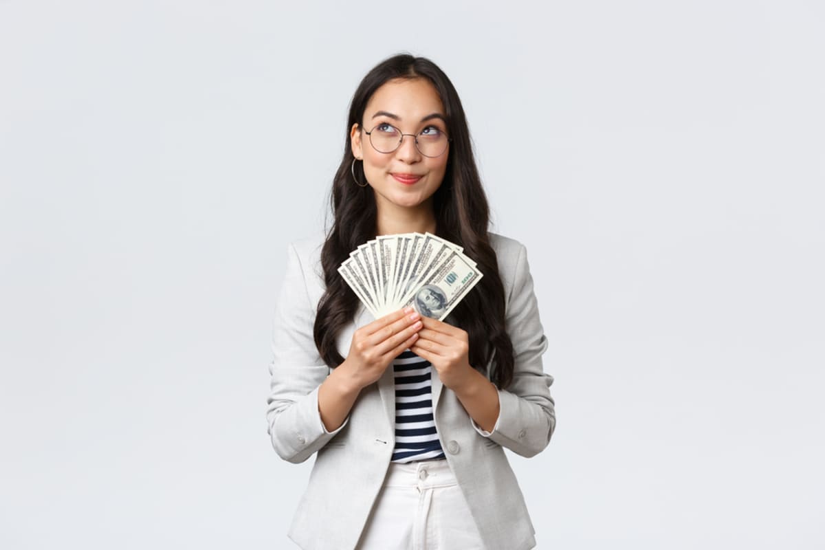 A woman holding cash