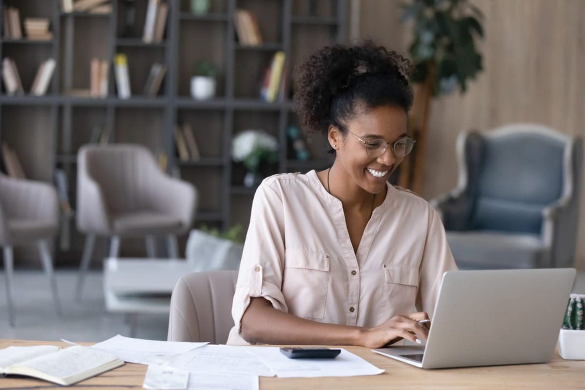 Happy woman at her laptop