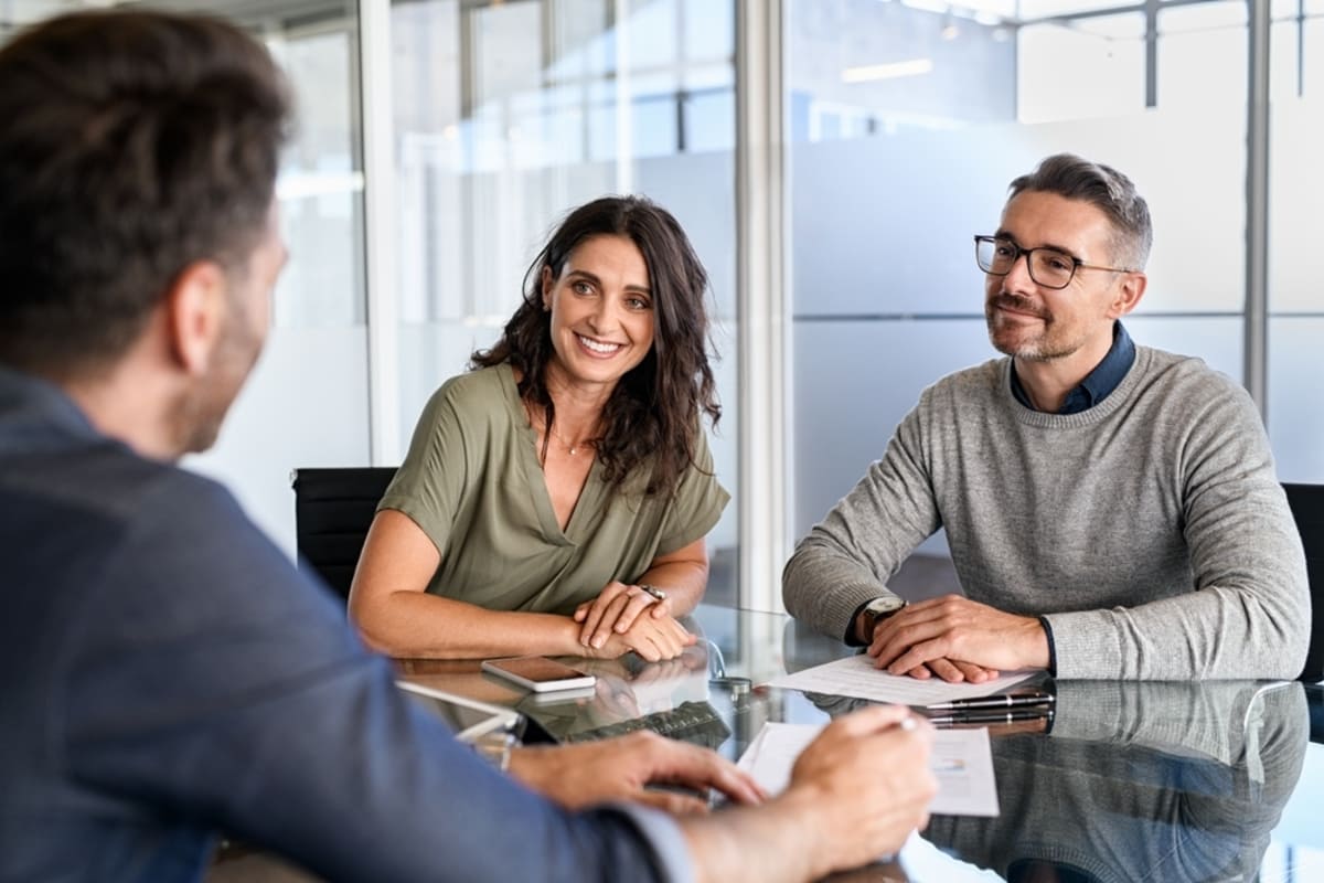 Two people talking with a professional