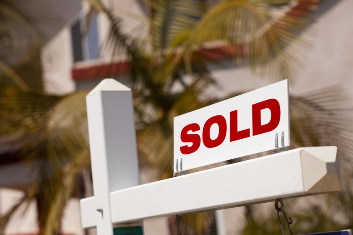 Close-up of Sold Real Estate Sign in Front of House