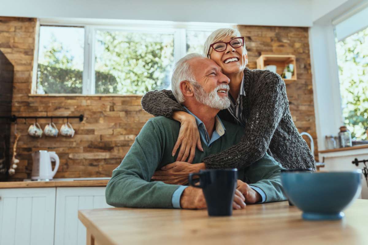 Mature woman hugging her husband