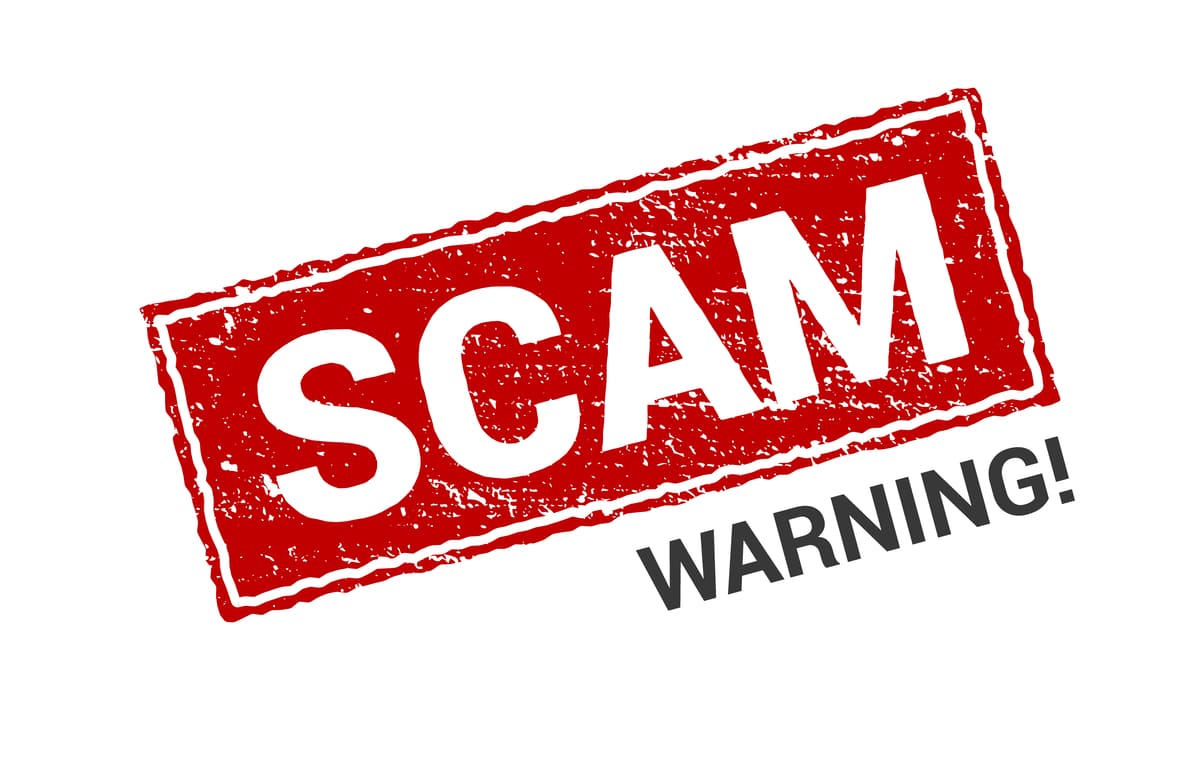 Scam Warning stamped on a white background, beware of real estate scams concept