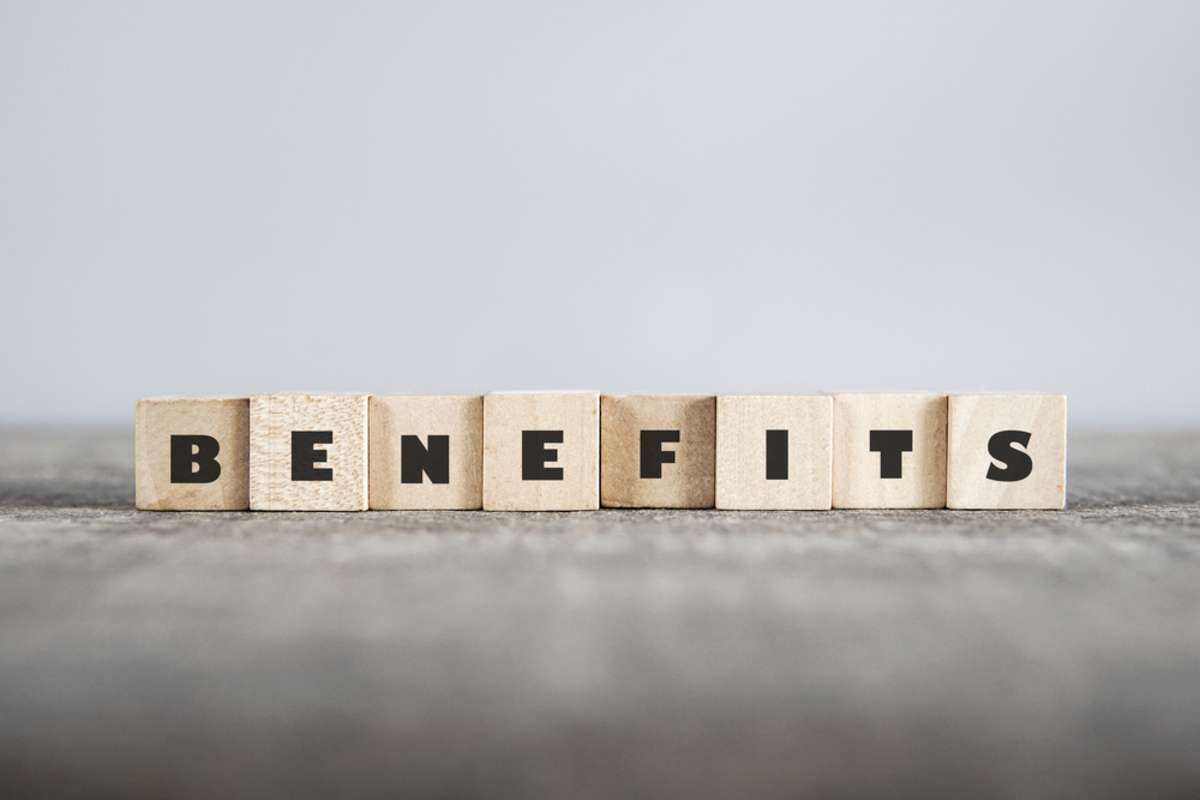 Benefits spelled in wood blocks, benefits of selling your home to a cash buyer concept. 