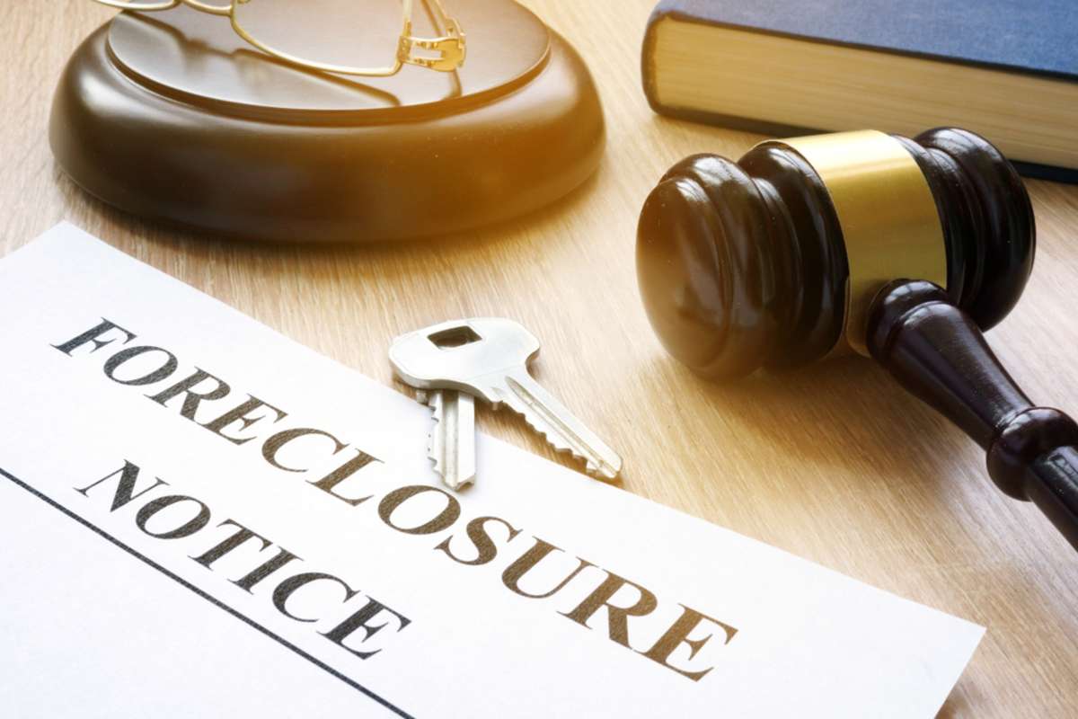 Foreclosure notice, companies that buy homes for cash concept. 